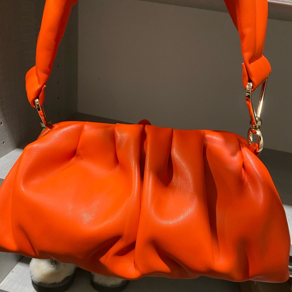 Liviana Conti red leather clutch